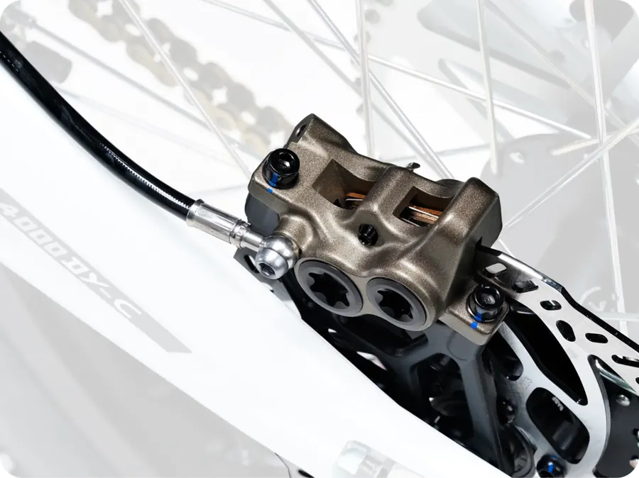 Forged opposed four-piston brake caliper